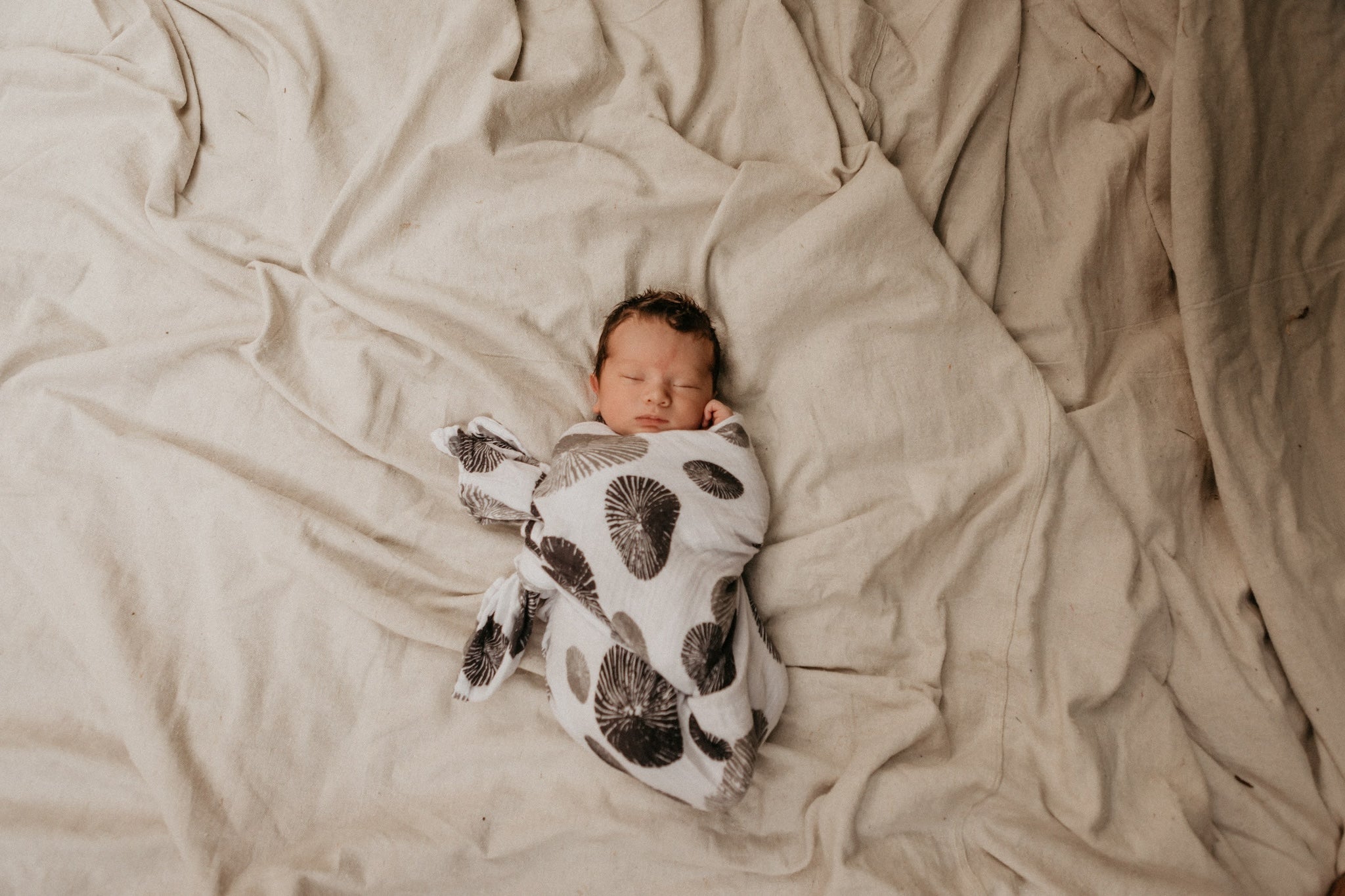 baby wrapped in opihi baby swaddle